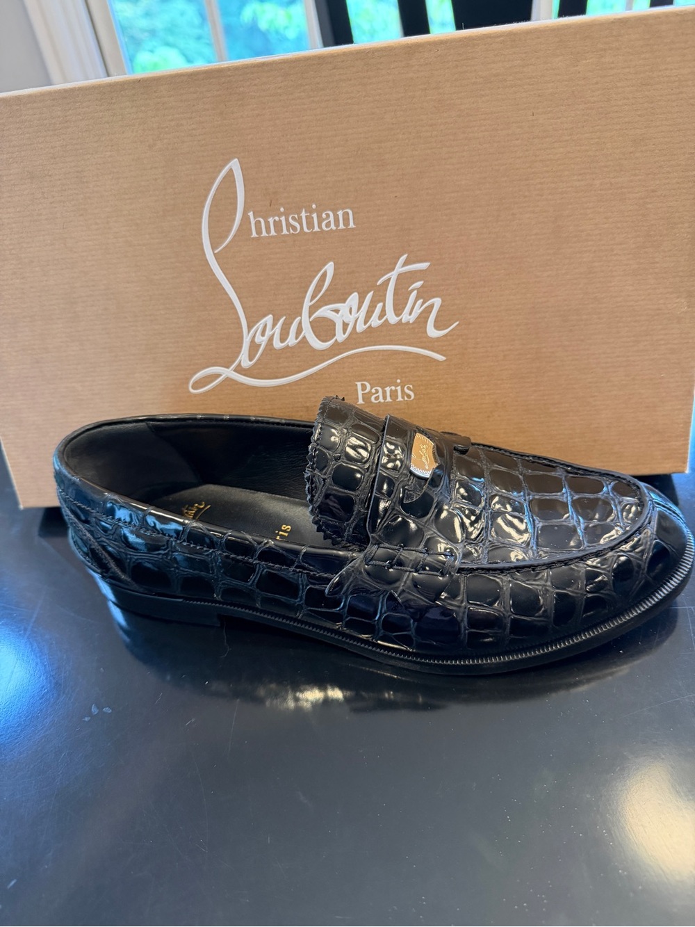 Christian Louboutin Women’s Black Croc-Embossed Patent Leather Penny Loafers.